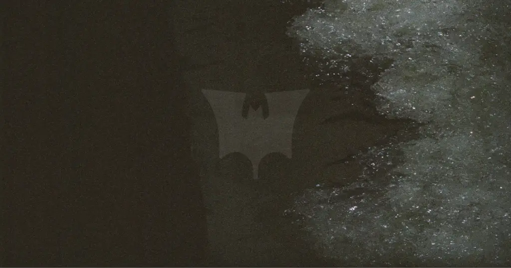 Bat symbol on a dark, grungy background